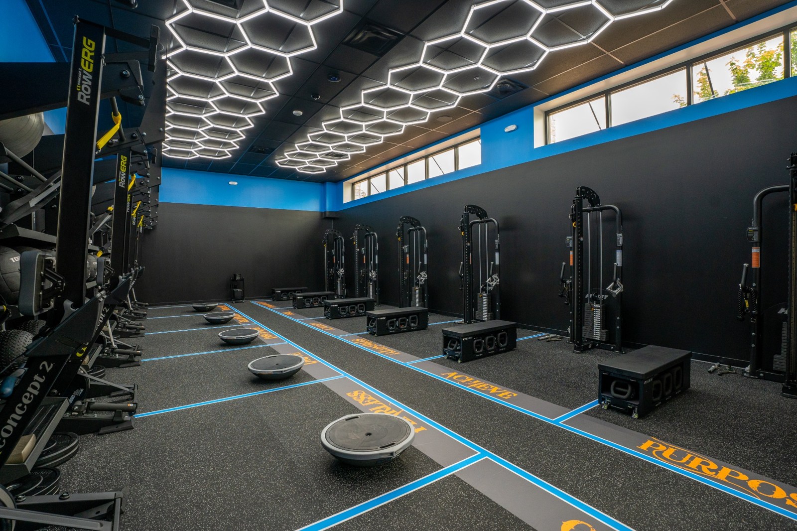 Supplied studio photograph of the FitCamp room with blue lanes and hexagon ceiling lights